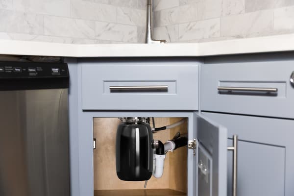 A garbage disposal under a sink